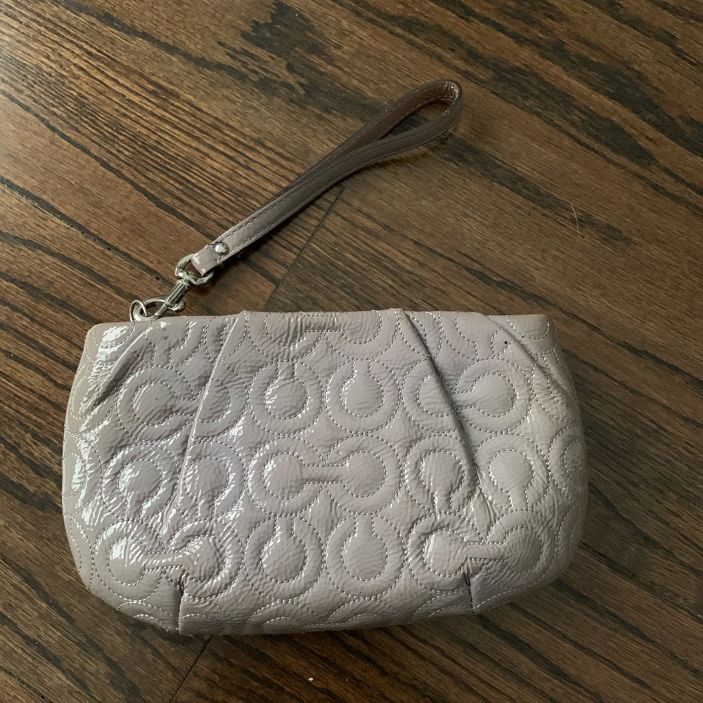 Light lilac/ grayish Coach wristlet